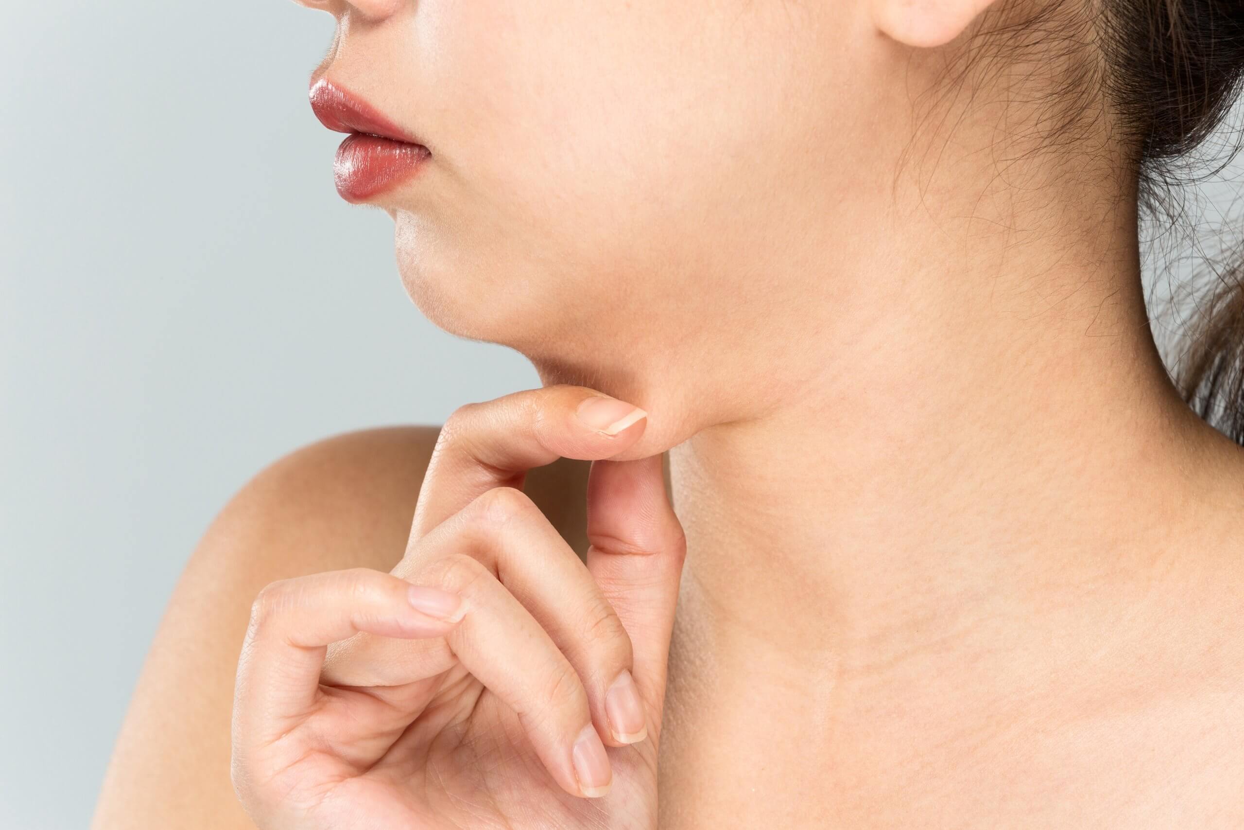 woman pinching double chin