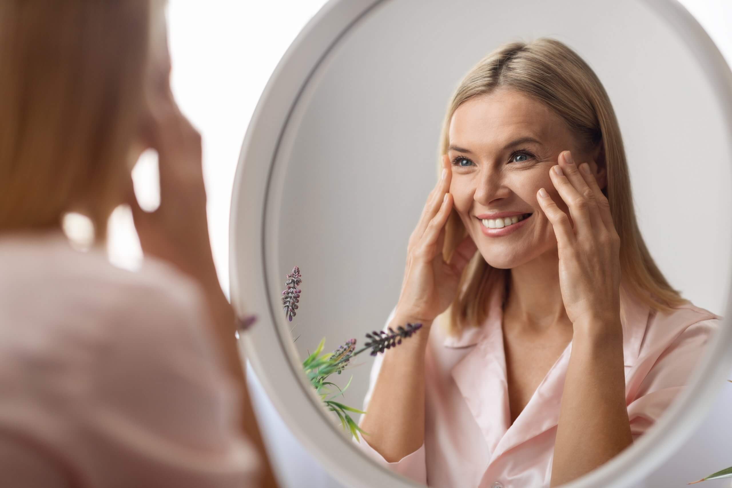 woman facelift looking in mirror