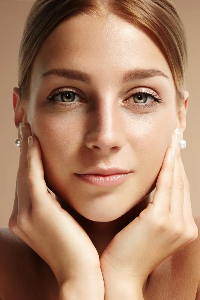 Woman showing the lower face and jawline for mini facelift treatment